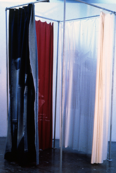 "Changing Room"  clothing items, fabric, metal poles.  7ft x 3ft x3ft
1990s.  I took apart my jeans, t-shirt, bra, underwear, and stitched them back into similar fabric.
